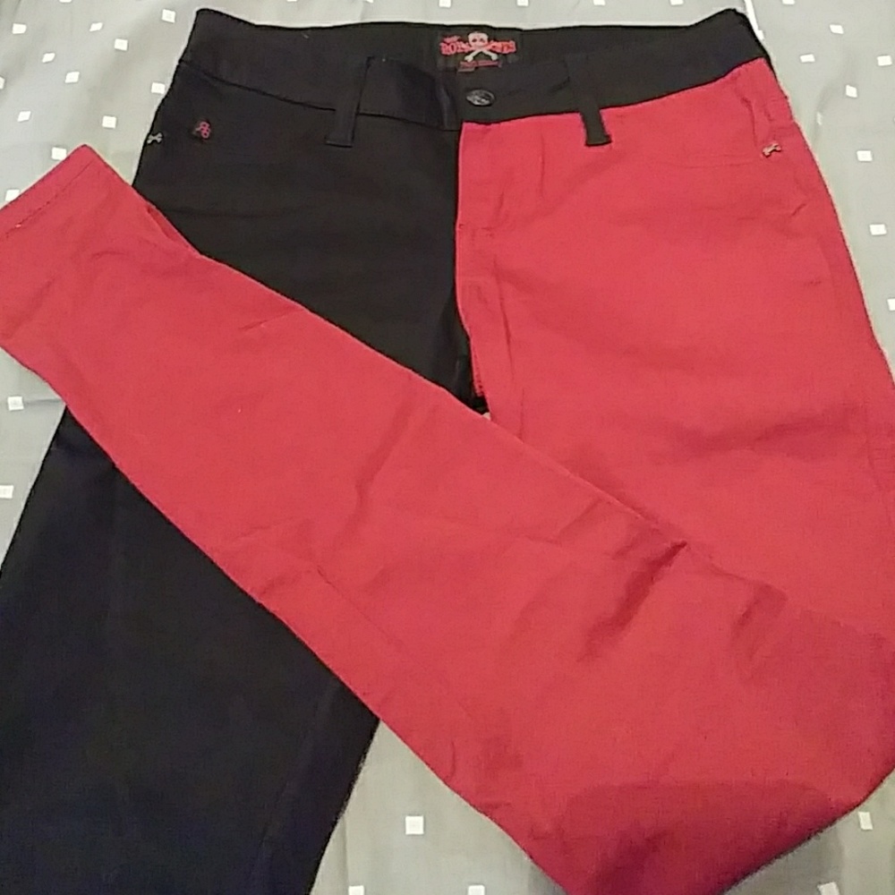 Half black half red skinny jeans